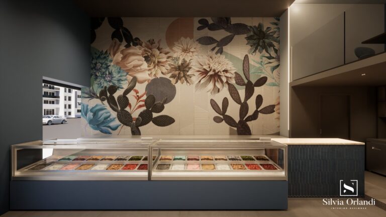 Vetrina per gelati artigianali in locale di design con parete decorata da maxi-murale floreale e cactus, illuminazione integrata e progetto firmato Silvia Orlandi Interior Designer.